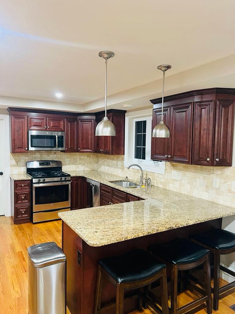 Kitchen with dark wood cabinets